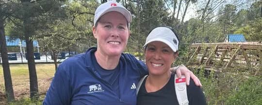 Audrey Banada and Sarah Ansboury smiling together.