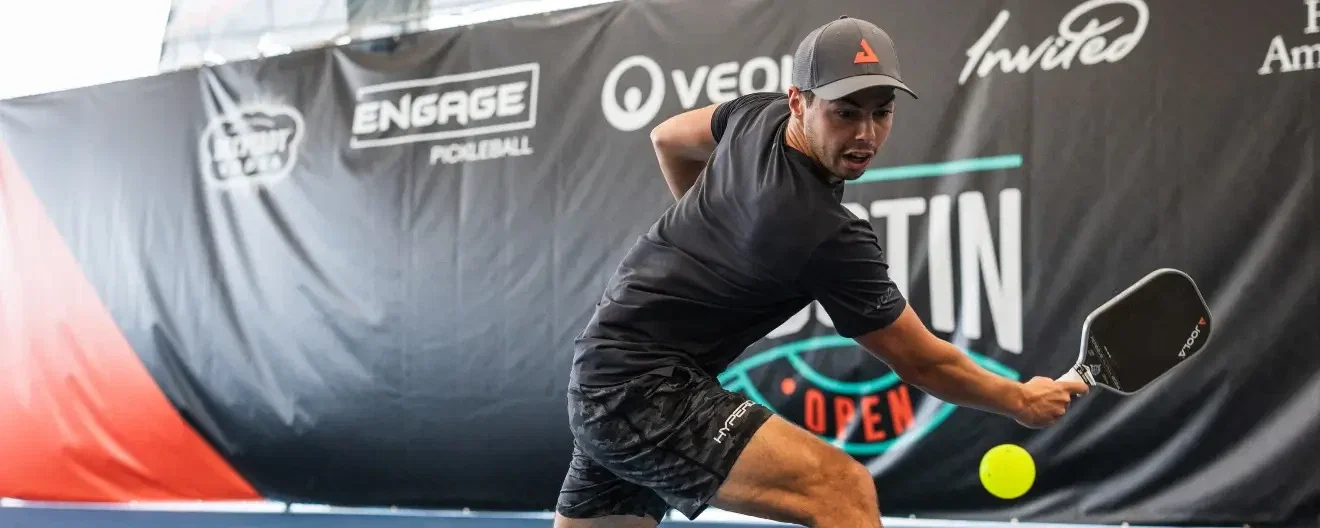 Ben Johns hits a pickleball backhand.