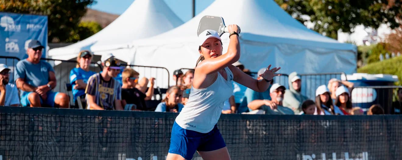 Zoey Wang hits a forehand.