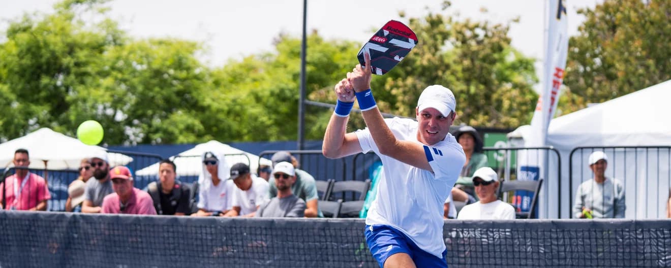 Chris Haworth hits a backhand.