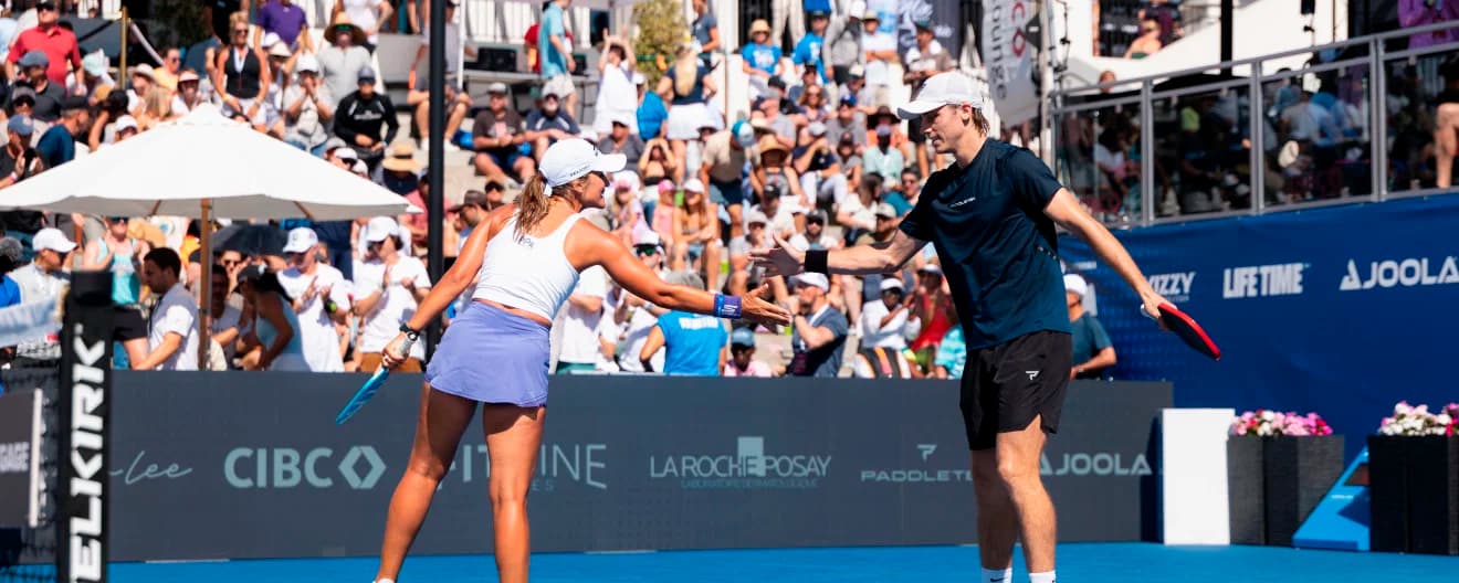 Catherine Parenteau and Christian Alshon celebrate a victory.