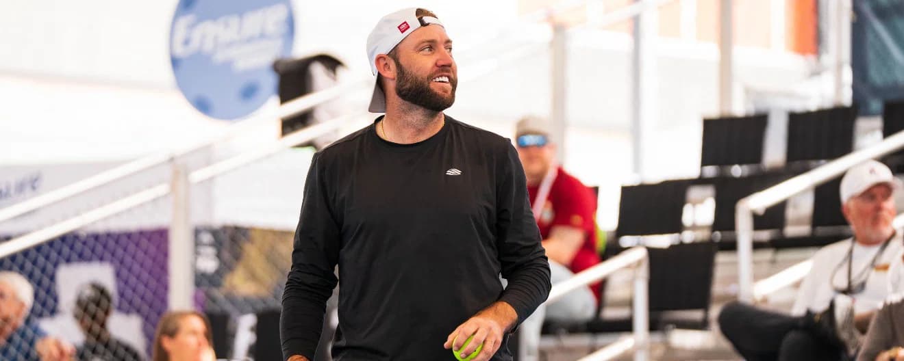 Jack Sock smiling in between points.