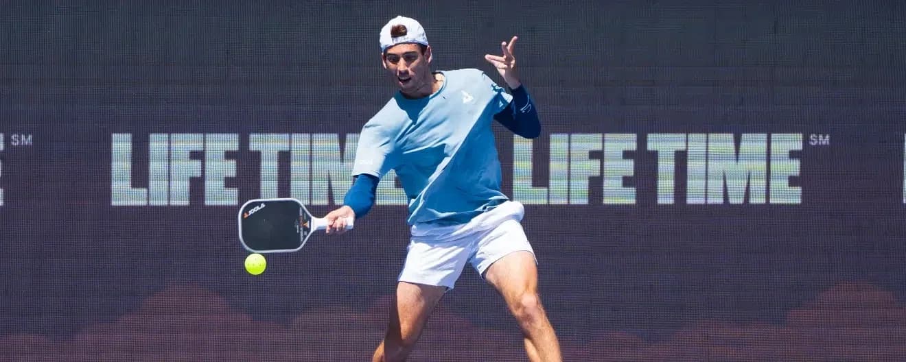 Federico Staksrud hits a pickleball forehand.