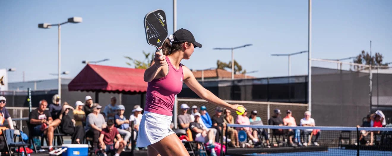 Vivian Glozman hits a pickleball serve.
