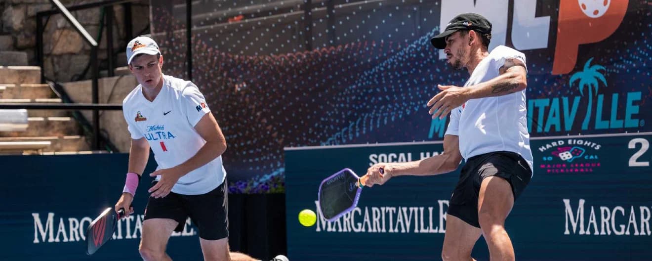 Jaume Martinez Vich and Todd Fought playing men's doubles.