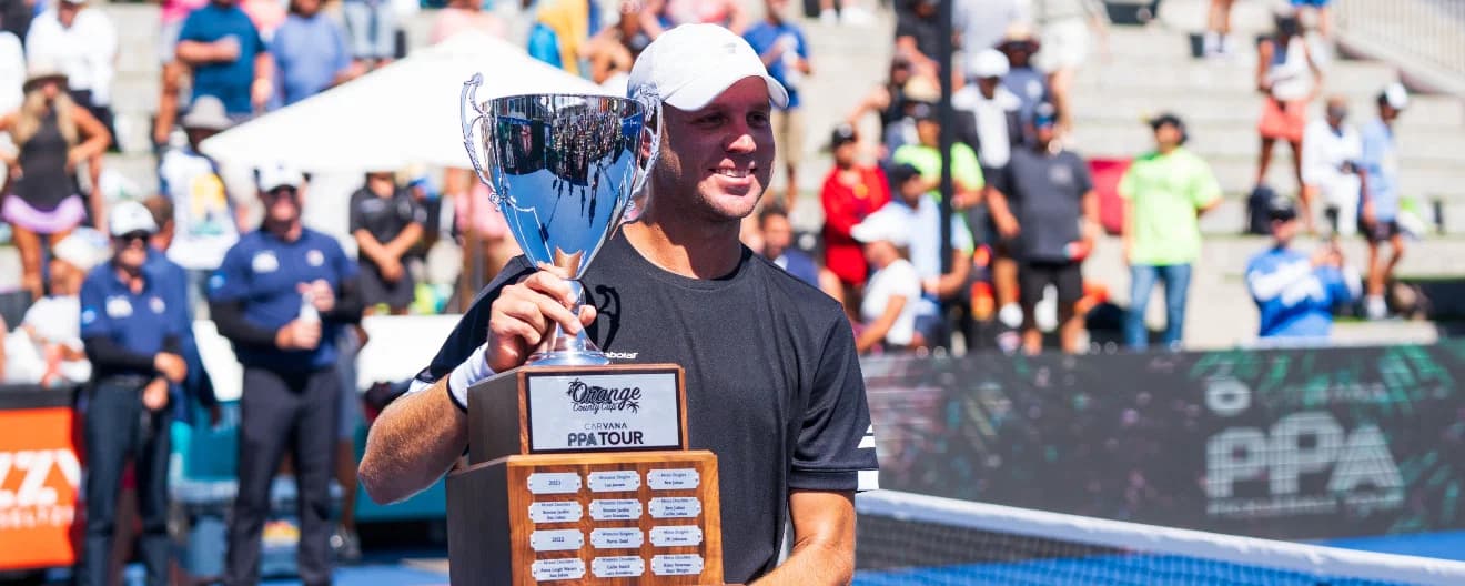 Chris Haworth holding the championship trophy.